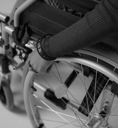 black and white photo of a person in a wheelchair