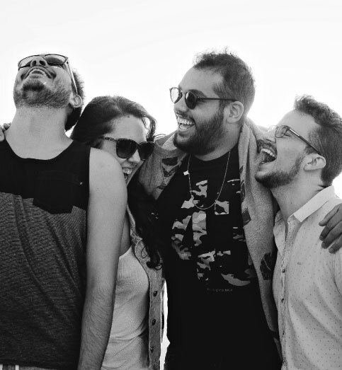 black and white photo of friends laughing together